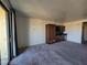 Living room featuring kitchenette with cabinetry and carpeted floor at 29 Montelago Blvd # 336, Henderson, NV 89011
