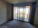 Living room boasts sliding glass doors leading to a balcony offering outdoor views at 29 Montelago Blvd # 336, Henderson, NV 89011