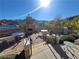 Outdoor patio featuring a fireplace, dining tables, and views of the water and surrounding mountains at 29 Montelago Blvd # 336, Henderson, NV 89011