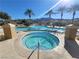 Outdoor pool and jacuzzi offer a relaxing space with palms and views of the desert mountains at 29 Montelago Blvd # 336, Henderson, NV 89011