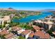 Stunning aerial view of the lakefront community showcasing waterfront homes and the surrounding landscape and mountain views at 29 Montelago Blvd # 520, Henderson, NV 89011