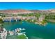 Expansive aerial view of the lake showcasing a community with a marina, bridge, and scenic desert landscape at 29 Montelago Blvd # 520, Henderson, NV 89011