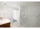 Bathroom with modern fixtures, white tile shower, and open concept leading to walk-in closet space at 29 Montelago Blvd # 520, Henderson, NV 89011