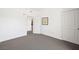 Bedroom with neutral carpet and baseboards, white walls, and a doorway leading to another room at 29 Montelago Blvd # 520, Henderson, NV 89011