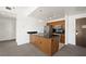 Modern kitchen with stainless steel appliances and a breakfast bar island at 29 Montelago Blvd # 520, Henderson, NV 89011