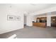 Spacious living room featuring neutral carpet with an open view of the kitchen at 29 Montelago Blvd # 520, Henderson, NV 89011