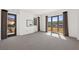 Bright living room with balcony and mountain views, and neutral colored carpet at 29 Montelago Blvd # 520, Henderson, NV 89011