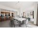 Open concept living space with kitchen bar, modern dining table, and comfortable living area with ample natural light at 29 Montelago Blvd # 520, Henderson, NV 89011