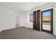 Bright main bedroom with a balcony view, ensuite bath, and modern finishes creating a serene retreat within the home at 29 Montelago Blvd # 520, Henderson, NV 89011
