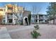 Modern apartment building featuring neutral tones, balconies, and well-maintained landscaping and walking path at 2900 Sunridge Heights Pkwy # 518, Henderson, NV 89052