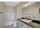Bathroom with tub and shower, vanity, and modern lighting fixture at 2900 Sunridge Heights Pkwy # 518, Henderson, NV 89052