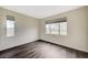 Bedroom features wood-look floors, neutral paint, baseboards and two windows providing natural light at 2900 Sunridge Heights Pkwy # 518, Henderson, NV 89052