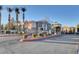 Community entrance featuring lush landscaping, decorative signage, and controlled access gate at 2900 Sunridge Heights Pkwy # 518, Henderson, NV 89052