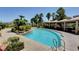 Resort-style community pool with tanning ledges, shaded cabanas, and lush tropical landscaping at 2900 Sunridge Heights Pkwy # 518, Henderson, NV 89052