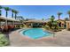 Inviting community pool with multiple cabanas, mature palm trees, and well-maintained landscaping at 2900 Sunridge Heights Pkwy # 518, Henderson, NV 89052