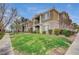 Beautiful two-story condo building with a well-manicured lawn and balcony views on a partly cloudy day at 2900 Sunridge Heights Pkwy # 518, Henderson, NV 89052