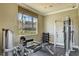 Private fitness center with weight machines, free weights, and a window offering views of the community at 2900 Sunridge Heights Pkwy # 518, Henderson, NV 89052