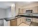 Modern kitchen with stainless steel appliances, sleek black countertops, and ample cabinet space for storage and organization at 2900 Sunridge Heights Pkwy # 518, Henderson, NV 89052