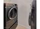Modern laundry room with updated stainless-steel washer and dryer machines at 2900 Sunridge Heights Pkwy # 518, Henderson, NV 89052