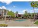 Community pool with lounge chairs and landscaping at 2900 Sunridge Heights Pkwy # 518, Henderson, NV 89052