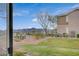 An outside view from the window showcases green grass, community landscapes, and mountains in the distance at 2900 Sunridge Heights Pkwy # 518, Henderson, NV 89052
