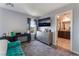 Cozy bedroom with a mounted TV, and access to an en-suite bathroom at 2935 Saltillo Ln, Las Vegas, NV 89121