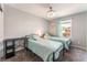 This is a bedroom with two twin beds, a desk, and a window at 2935 Saltillo Ln, Las Vegas, NV 89121