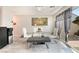 Bright dining area features modern table with seating and sliding glass doors to the backyard at 2935 Saltillo Ln, Las Vegas, NV 89121