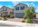Attractive two-story house featuring a brick driveway, two-car garage, and lovely yard at 2935 Saltillo Ln, Las Vegas, NV 89121