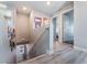 Well-lit upstairs hallway with modern flooring leads to various rooms, showcasing the home's layout at 2935 Saltillo Ln, Las Vegas, NV 89121