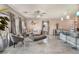 Open concept living space featuring stylish furniture, tile floors, and bright, natural light at 2935 Saltillo Ln, Las Vegas, NV 89121