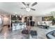 Open-concept living area with bar seating, tile floors, and modern decor at 2935 Saltillo Ln, Las Vegas, NV 89121