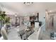 Open floor plan with eat-in kitchen and dining area featuring contemporary decor and plenty of natural light at 2935 Saltillo Ln, Las Vegas, NV 89121