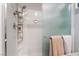 Close-up of a shower with sleek fixtures, built-in shelving, and a textured glass door at 2935 Saltillo Ln, Las Vegas, NV 89121