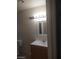 A half bathroom featuring a vanity with white countertop and brushed nickel faucet at 2981 Country Manor Ln # 118, Las Vegas, NV 89115
