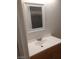 Bathroom featuring a vanity with light wood cabinets, a sink and a bright mirror at 2981 Country Manor Ln # 118, Las Vegas, NV 89115