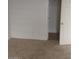 This carpeted bedroom has fresh paint and a doorway leading to another room at 2981 Country Manor Ln # 118, Las Vegas, NV 89115