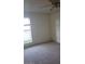 The bedroom features carpet, a ceiling fan, and a bright window for natural light at 2981 Country Manor Ln # 118, Las Vegas, NV 89115