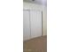 Bedroom with tan carpet and a white sliding door closet at 2981 Country Manor Ln # 118, Las Vegas, NV 89115