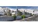 The exterior of this apartment building has a cinder block wall and ample landscaping around the property at 2981 Country Manor Ln # 118, Las Vegas, NV 89115
