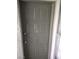 The front door to the home is a grey color, and it has a gold number on the door for the unit number at 2981 Country Manor Ln # 118, Las Vegas, NV 89115