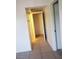 Hallway features tile flooring, white walls, and an open doorway at 2981 Country Manor Ln # 118, Las Vegas, NV 89115