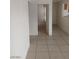 Hallway with neutral tile flooring connecting multiple rooms at 2981 Country Manor Ln # 118, Las Vegas, NV 89115