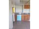 Updated kitchen featuring wood cabinets, tile countertops, stainless steel sink and a blue dishwasher appliance at 2981 Country Manor Ln # 118, Las Vegas, NV 89115