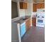 The kitchen features wood cabinets, a new white stove, stainless steel sink, and blue dishwasher appliance at 2981 Country Manor Ln # 118, Las Vegas, NV 89115