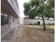 A spacious backyard with greenery and a pathway near building at 304 Orland St # 39, Las Vegas, NV 89107
