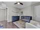 Comfortable Bedroom with a ceiling fan, changing table, crib and rocking chair at 3132 Cartanda Ave, Henderson, NV 89044