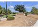Scenic view of Potenza Park entrance with greenery, mature trees, and well-maintained landscape at 3132 Cartanda Ave, Henderson, NV 89044