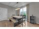 Dining area with modern light fixture and sliding glass door to outdoor space at 3132 Cartanda Ave, Henderson, NV 89044