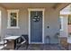 Inviting front porch seating area with a wreath on the front door at 3132 Cartanda Ave, Henderson, NV 89044